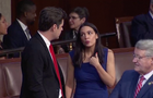 Reps. Matt Gaetz and Alexandria Ocasio-Cortez speak on the House floor on Jan. 3, 2023, ahead of a vote for speaker of the House. 