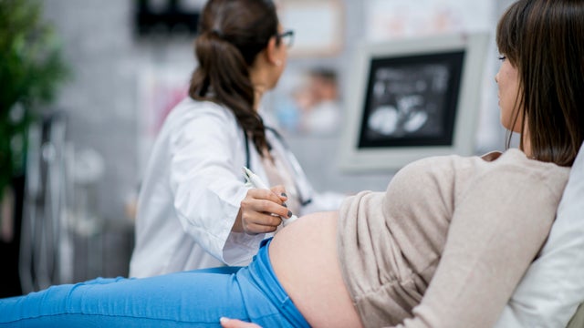 Pregnant woman gets an ultrasound exam 
