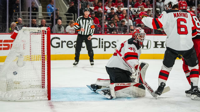 Akira Schmid #40 of the New Jersey Devils allows a goal by Brett Pesce #22 of the Carolina Hurricanes during the first period in Game One of the Second Round of the 2023 Stanley Cup Playoffs at PNC Arena on May 03, 2023 in Raleigh, North Carolina. 