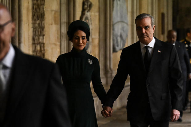 Dominican President Luis Abinader and his wife Raquel Arbaje arrive for the coronation at Westminster Abbey. 