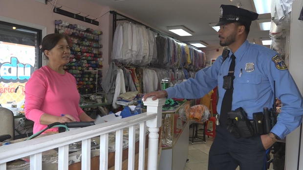 officer-ung-with-shop-owner.jpg 