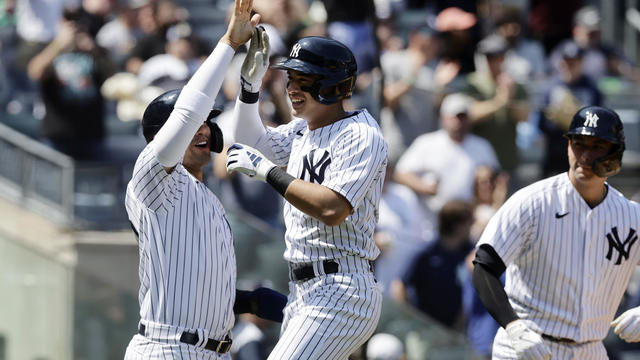 Anthony Volpe #11 of the New York Yankees celebrates his fifth inning grand slam home run against the Oakland Athletics with teammates Oswaldo Cabrera #95 (L) and Kyle Higashioka #66 (R) at Yankee Stadium on May 10, 2023 in Bronx, New York. 
