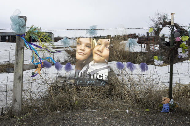 A picture of Tylee Ryan and J.J. Vallow is seen on a fence opposite the property where their bodies were 