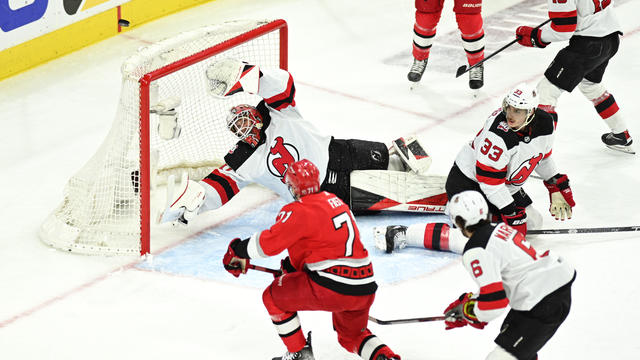 New Jersey Devils Goalie Akira Schmid (40) dives to catch a shot from Carolina Hurricanes Right Wing Jesper Fast (71) during game 5 of the second round of the Stanley Cup Playoffs between the New Jersey Devils and the Carolina Hurricanes on May 11, 2023 a 