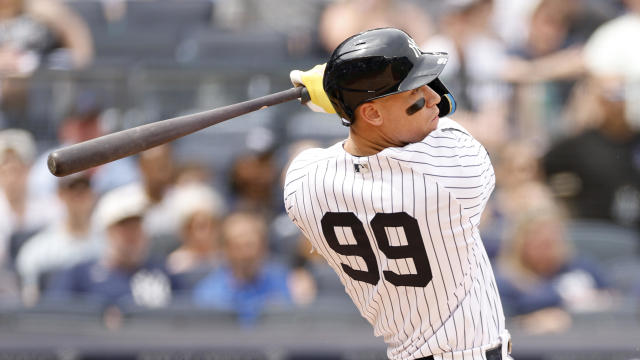 Aaron Judge #99 of the New York Yankees hits a two-run home run during the fifth inning against the Tampa Bay Rays at Yankee Stadium on May 13, 2023 in the Bronx borough of New York City. 