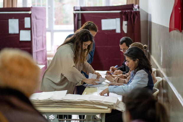 Officials count ballots at a polling station during presidential and parliament elections in the Kadikoy district of Istanbul, Turkey, on Sunday, May 14, 2023. 