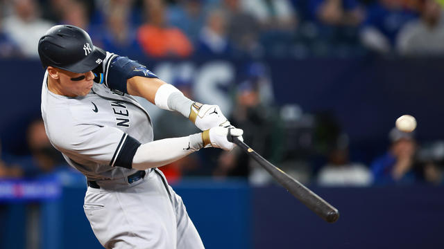 Aaron Judge #99 of the New York Yankees hits a home run in the eighth inning against the Toronto Blue Jays at Rogers Centre on May 16, 2023 in Toronto, Ontario, Canada. 