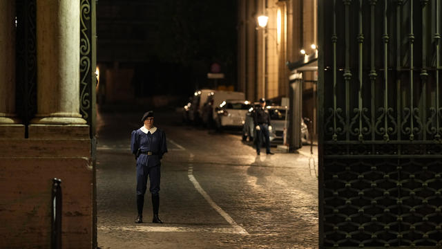 Vatican City, the Swiss Guards on patrol at the Porta Sant'Anna entrances of Vatican city wearing protective masks. 