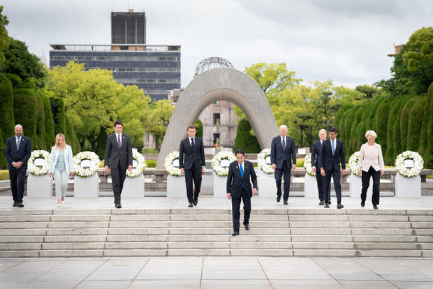 G7 leaders prepare to pose for a group photo after laying wreaths at the Cenotaph for Atomic Bomb Victims in the Peace Memorial Park on May 19, 2023, in Hiroshima, Japan. 