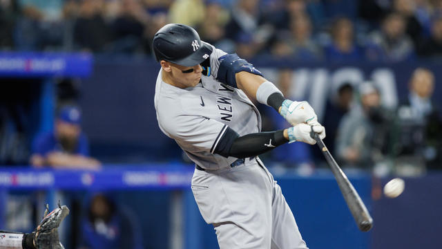 Aaron Judge #99 of the New York Yankees hits a two-run home run in the first inning against the Toronto Blue Jays at Rogers Centre on May 18, 2023 in Toronto, Canada. 