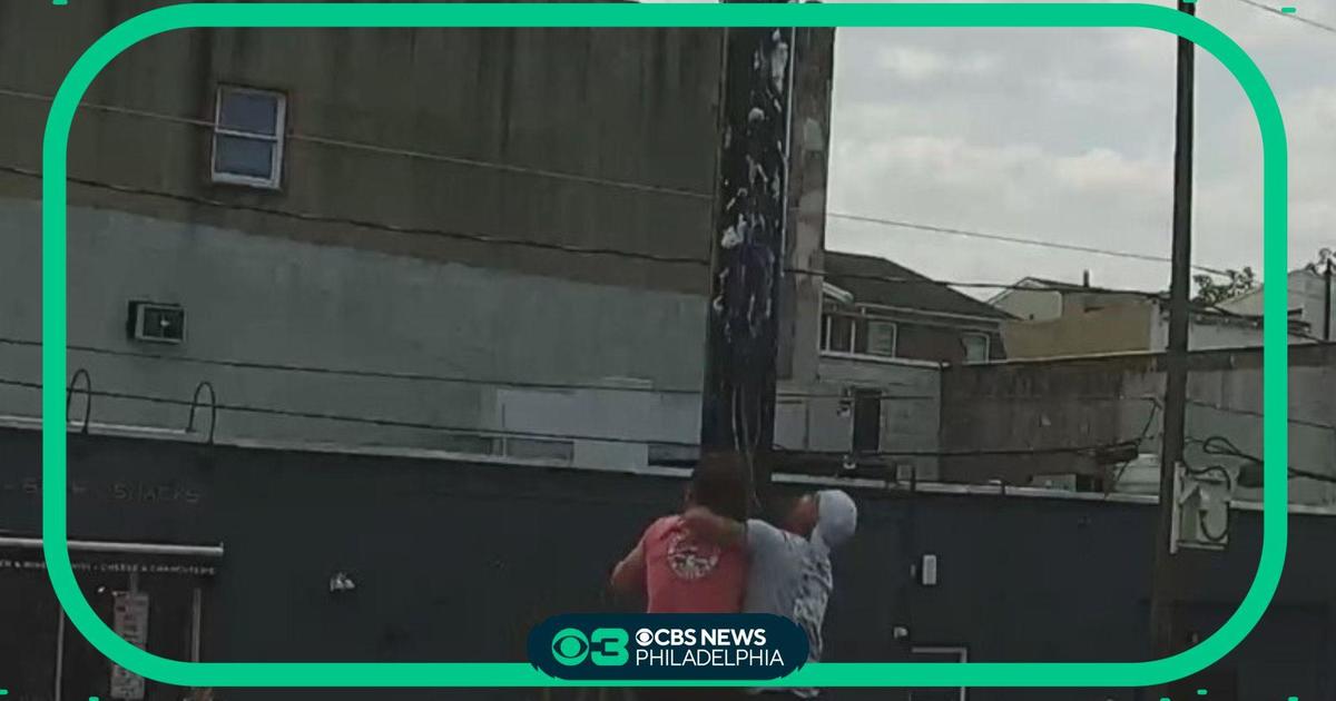 Italian Market festival wraps up with greased pole climbing CBS