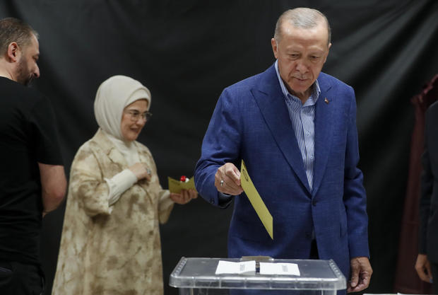 President Recep Tayyip Erdogan and his wife Emine Erdogan arrive at a polling station to cast their vote during the Turkish presidential election runoff on May 28, 2023 in Istanbul, Turkey. 