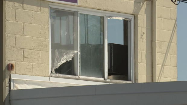 window-broken-at-langhorne-middletown-township-gun-store-pennsylvania.jpg 