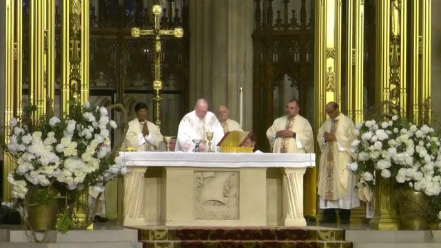 Timothy Cardinal Dolan leads mass inside St. Patrick's Cathedral. 