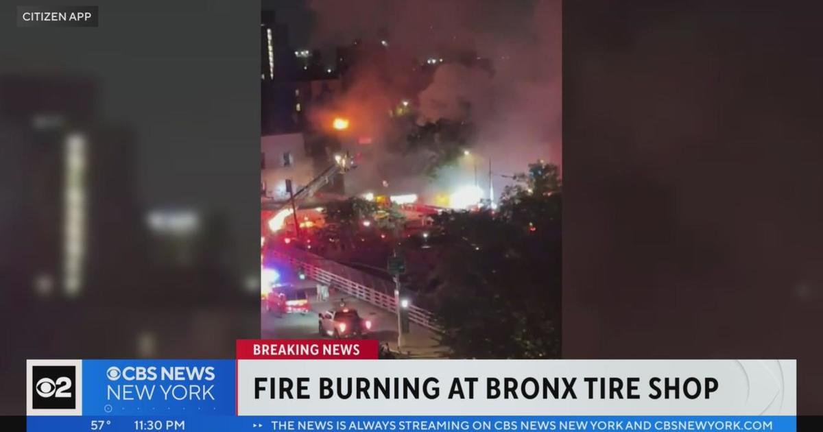 Fire burning at Bronx tire shop - CBS New York