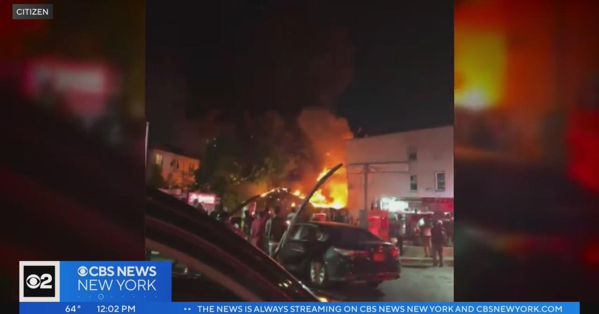 Fire rips through row of businesses in the Bronx - CBS New York