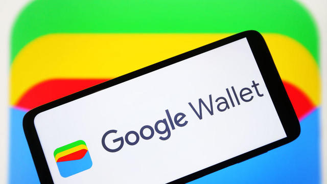 In this photo illustration, a Google Wallet logo is seen on 