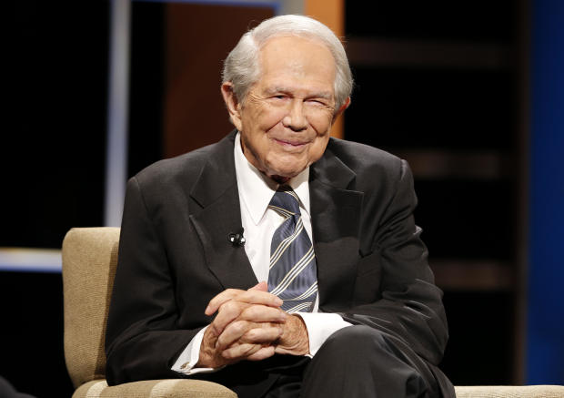 The Rev. Pat Robertson poses a question to a Republican presidential candidate during a forum at Regent University in Virginia Beach, Va., Oct. 23, 2015. 