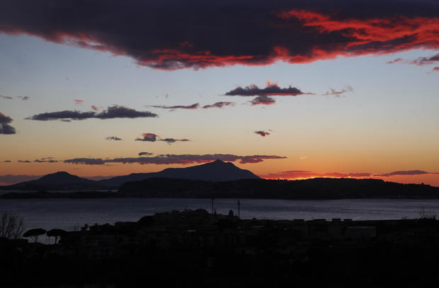 View the Pozzuoli city seafront in the colors of the sunset 