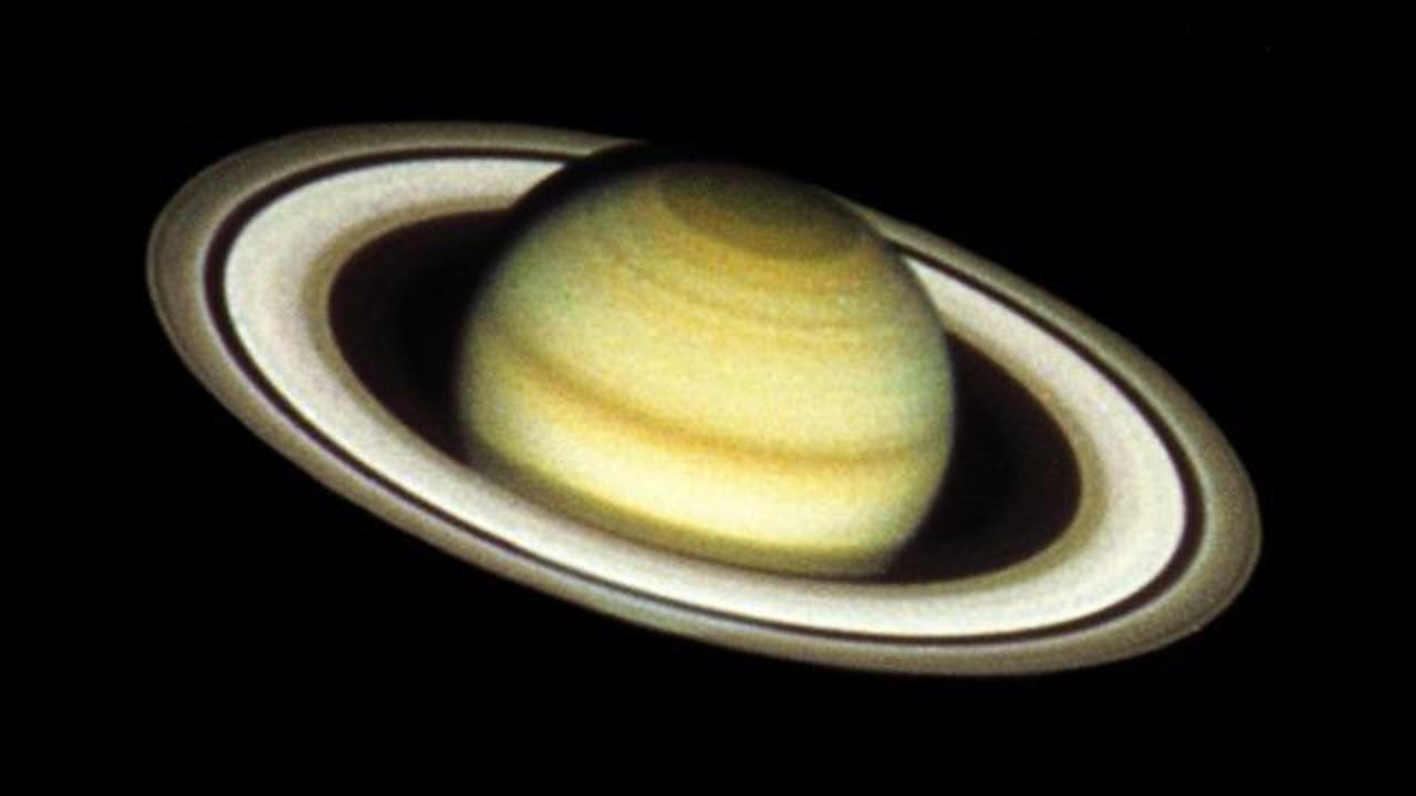 Saturn's Weirdest Ring Explained: Ancient Collision Caused It | Space