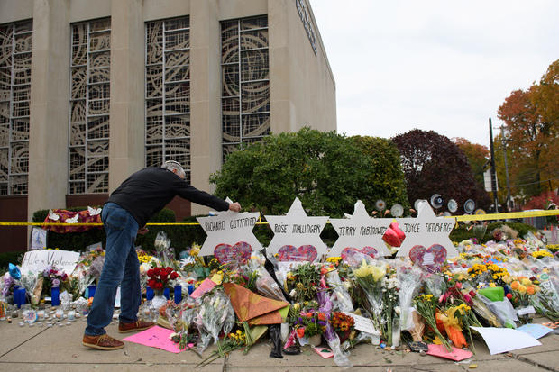 Mourners visit a memorial outside the Tree of Life synagogue in Pittsburgh 