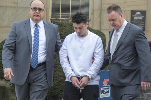 MS-13 gang leader Victor Lopez is led out of the Nassau County District Attorney's office in Mineola, New York on January 11, 2018. 
