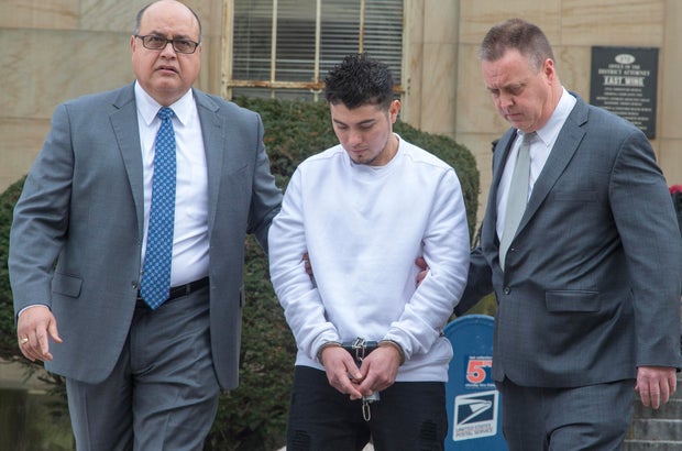 MS-13 gang leader Victor Lopez is led out of the Nassau County District Attorney's office in Mineola, New York on January 11, 2018.