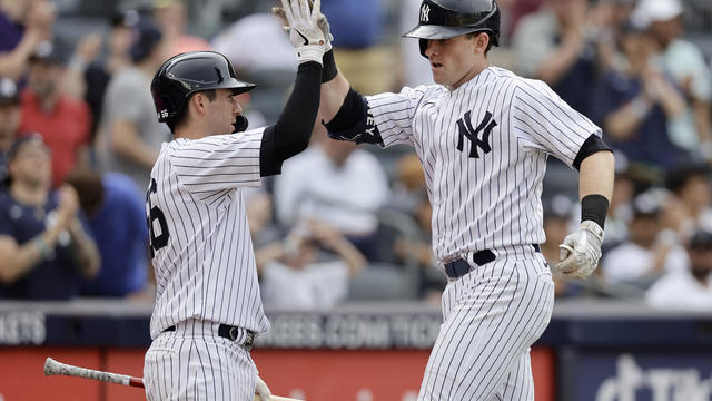 illy McKinney #57 of the New York Yankees celebrates his third inning home run against the Texas Rangers with teammate Kyle Higashioka #66 at Yankee Stadium on June 24, 2023 in the Bronx borough of New York City. 