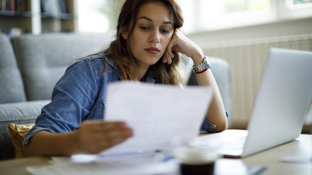 Worried woman about home finances 
