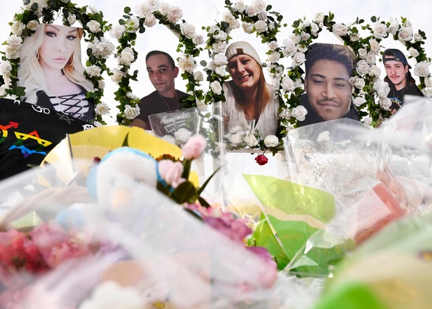 Photographs of victims of a mass shooting at a gay nightclub are on display at a memorial on November 23, 2022, in Colorado Springs, Colorado.