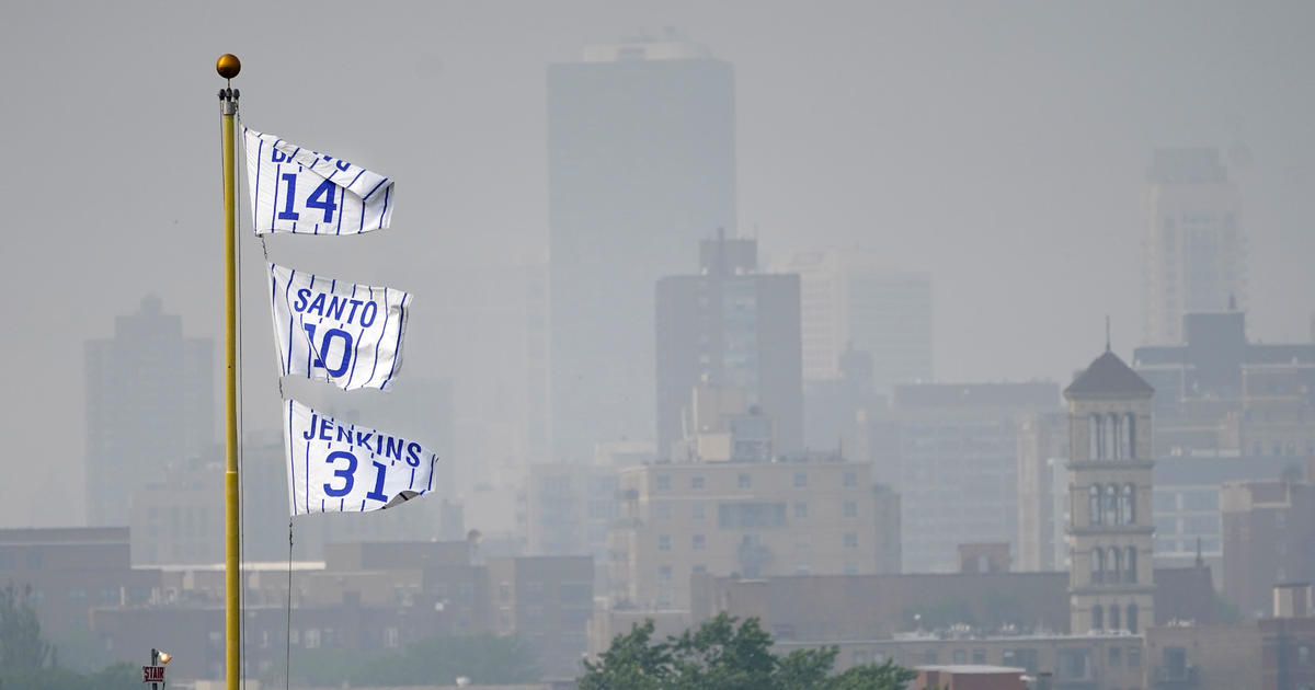 What led to MLB's decision to play Tuesday's Chicago Cubs game at Wrigley  Field in 'very unhealthy' air quality conditions?