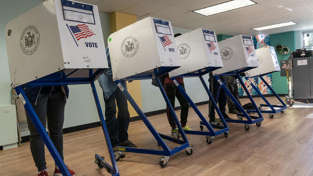 People seen voting at a polling station in the Bronx on 