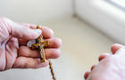 The Divine Mercy Rosary in woman hands 