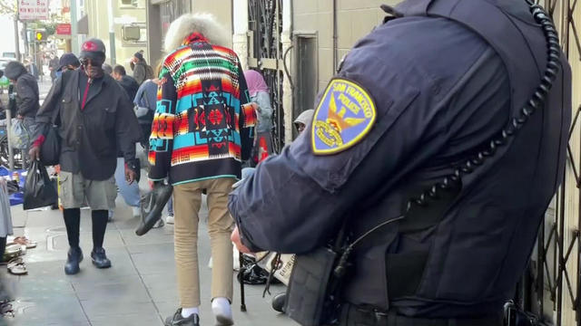 SFPD Officer Monitors Street Traffic 