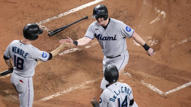 Garrett Cooper of the Miami Marlins singles during the third