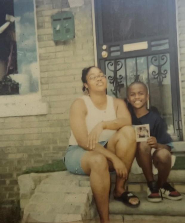 Tray Little as a child in front of his childhood home in Detroit. 