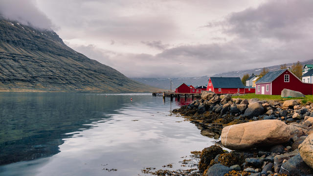 Eskifjordur is a charming seaside village in the mid of the eastern Fjords and the red-colored and well-preserved houses and fishing sheds lined up and down the shore provide an amazing view. 