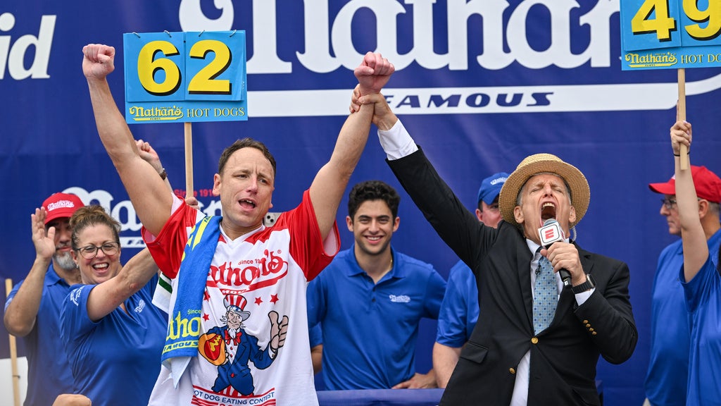 July Fourth hot dog eating contest mens competition won by Joey Chestnut with 62 hot dogs and buns July Fourth hot dog eating contest mens competition won by Joey Chestnut with 62 hot dogs and buns