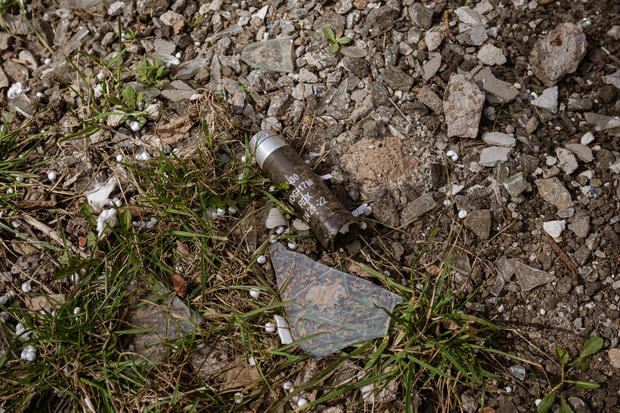 A cluster bomb capsule is seen on the ground in Ukraine 