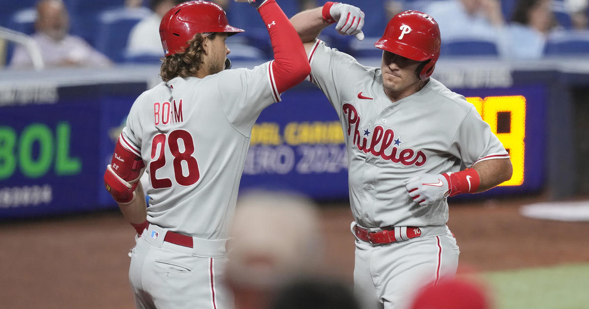 Phils rally earlier Marlins for report-tying 13th straight road earn