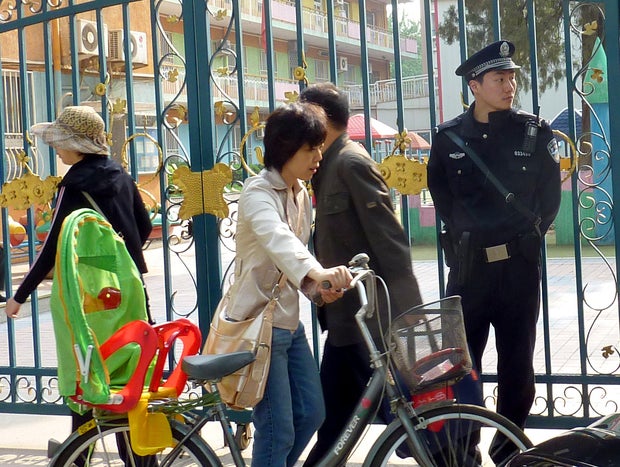 A Chinese policeman monitors the situati