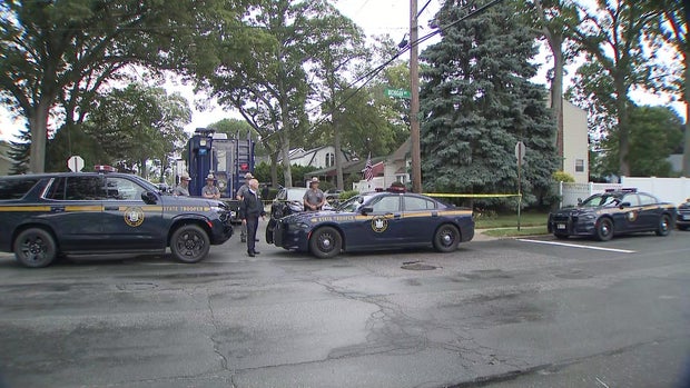 A large police presence outside a home in Massapequa Park