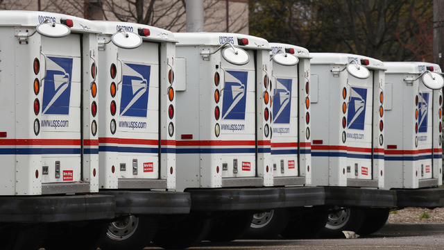 A general view of United States Postal Service trucks on April 12, 2020 in Farmingdale, New York. 