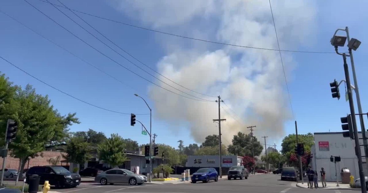 RAW: Video shows smoke plume above Woodland structure Fire