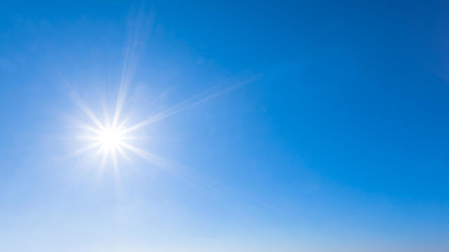 sparkle sun on a blue sky, natural background 