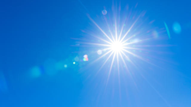Sunburst With Lens Flare. Clear sky, Sun, Blue sky 