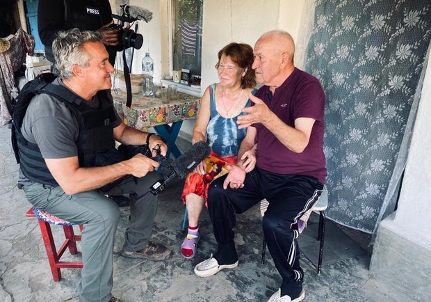 Victor and Lubya speak with CBS News' Charlie D'Agata at their home in the village of Vremivka, in Donetsk, southeast Ukraine, July 18, 2023