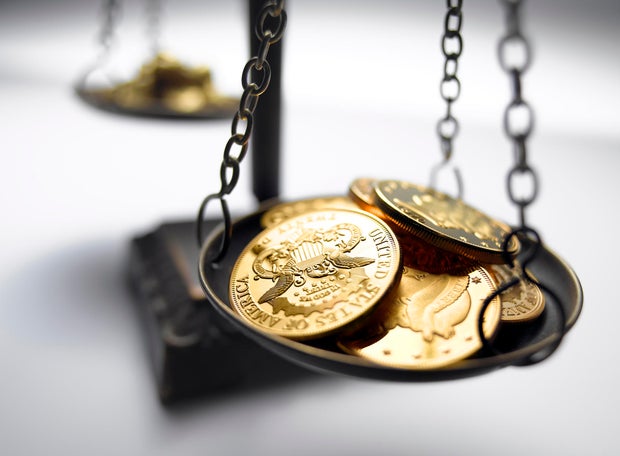 Gold Coins on Scale