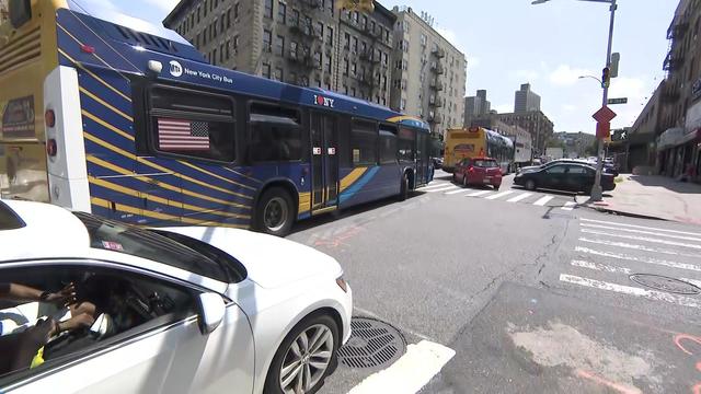 Multiple city buses, vehicles and trucks sit in bumper-to-bumper traffic on Broadway at West 184th Street. 