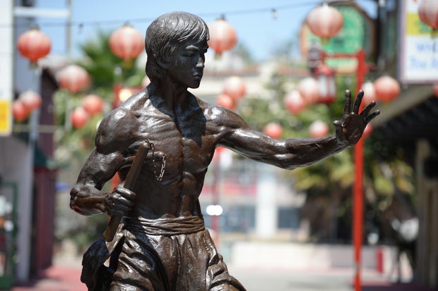 A statue of the late martial arts icon Bruce Lee is seen in Chinatown in downtown Los Angeles, June 16, 2013.